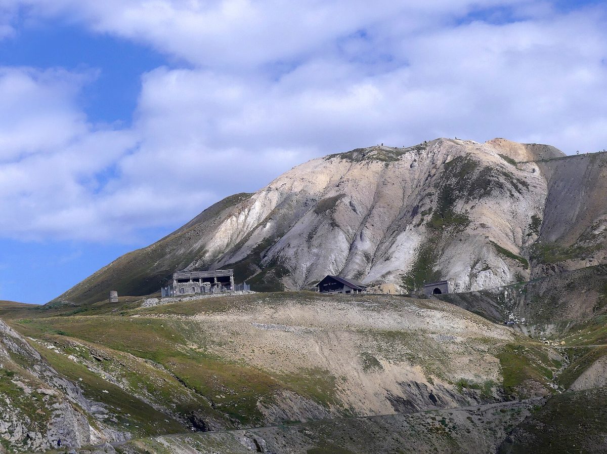 The Col du Galibier seen from the road on the Hautes-Alpes side, with the summit building and tunnel below grey peaks