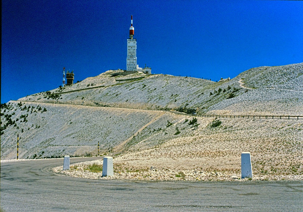 Bare limestone summit of Mont Ventoux with the road climbing the south face toward the observatory